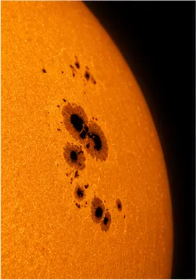 Illustration of sunspots look dark on the bright sun for the question "Why do sunspots look dark on the bright Sun?"